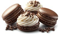 Chocolate macarons filled with vanilla cream and decorated with chocolate shavings on white background, fresh gourmet French pastry dessert.