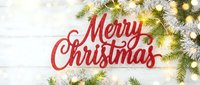 Merry Christmas red lettering sign on white wood background with fir branches and glowing bokeh lights, festive holiday flat lay banner.