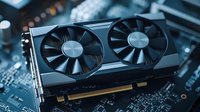 Modern graphics card with dual cooling fans on blue circuit board background, close-up view showing detailed electronic components and cooling system.