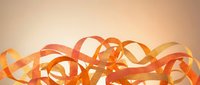 Abstract flowing orange ribbons creating dynamic waves and curves on warm gradient background for modern design projects and creative presentations.
