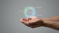 Male hand holding glowing holographic interface with data analytics icons and performance metrics for technology, business intelligence, and digital innovation concepts.