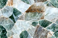 Natural green and white marble stone texture with brown veins, crystalline structure close-up view shows luxurious mineral pattern surface.