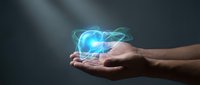 Hands holding glowing digital brain hologram with neural networks and light effects representing artificial intelligence and futuristic technology concepts.