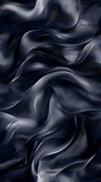 Elegant dark gray silk fabric with flowing waves and soft folds creates dramatic light and shadow effects, suitable for luxury fashion and interior design backgrounds.