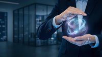 Professional businessman protecting glowing recycling symbol with hands in modern office environment representing environmental sustainability and corporate responsibility.