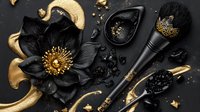 Black and gold luxury cosmetics flat lay with dark flower, makeup brushes and decorative elements on black background. Elegant beauty concept.