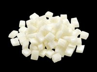 Pile of diced white coconut pieces isolated on transparent background, ready for food clipart, stickers, print on demand, sublimation, and t-shirt design use.