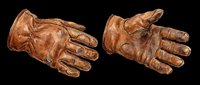 Pair of worn brown leather gloves isolated on transparent background, ready for t-shirt design, stickers, clipart, print on demand, and sublimation projects.