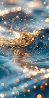 Magical golden wave splash with glowing bokeh lights and sparkles against turquoise water background, creating dreamy atmosphere for luxury designs.