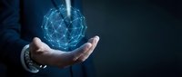 Businessman holding glowing digital network sphere with connected nodes representing global connectivity, technology innovation and data communication solutions.