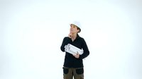 Male construction worker wearing hard hat and dark jacket holding blueprints on white background, isolated for design use.