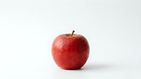 Fresh red apple isolated on white background for healthy eating and nutrition concepts.