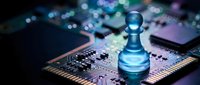 Blue chess pawn piece standing on computer circuit board with colorful bokeh lights representing strategic technology planning and digital innovation concepts.