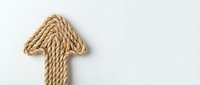 Upward arrow made from twisted jute rope on white background, symbolizing growth, progress and success for business and financial concepts.