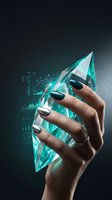 Hand holding glowing turquoise crystal with digital data analytics charts and graphs overlay for business intelligence and technology concepts.