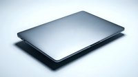Modern silver laptop computer closed on clean white background isolated for technology and business design projects.