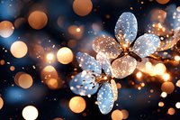 Glowing crystal flower with sparkling bokeh lights against dark background creates magical atmosphere. Dreamy macro photography with orange and blue tones.