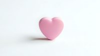 Pink heart shape on white background for Valentine's Day, love, romance, wedding, greeting cards, social media posts, and romantic design projects.