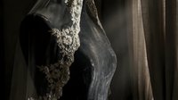 Elegant black lace lingerie on female silhouette with dramatic lighting and flowing fabric creating sensual intimate apparel photography for fashion design.