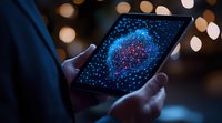 Digital network visualization on tablet screen with glowing blue and red nodes against dark background with bokeh lights, hands holding device.