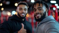 Two young African American men smiling and showing thumbs up gesture at night with blurred city lights background. Friendship and positive emotions concept.