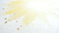 Yellow liquid spill stain on white surface with droplets and splashes creating mess requiring cleanup and maintenance attention.