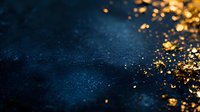 Magical golden glitter scattered on dark blue textured background with bokeh effect and copy space, creating atmospheric festive mood for luxury designs.