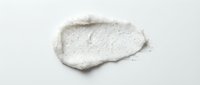 White textured paste or clay smear isolated on light background, suitable for cosmetics, skincare, beauty product mockups, and design applications.