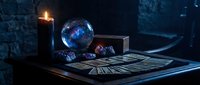 Mystical fortune telling setup with glowing crystal ball, tarot cards, ancient books and candle flame creating atmospheric divination scene for spiritual guidance.
