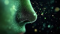 Side profile of nose made of glowing green particles dispersing into dark space with bokeh light effects and sparkles against black background.