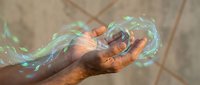 Hands cupping glowing green magical energy with swirling light effects for fantasy gaming and supernatural design projects.