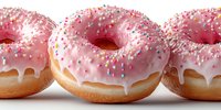 Three glazed donuts with pink icing and colorful sprinkles on white background. Sweet bakery treats perfect for cafe menus, dessert promotions and food advertising.