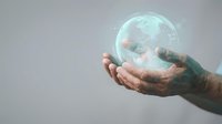 Male hands holding glowing digital globe with holographic earth map, representing global connectivity, technology, and worldwide business communication networks.