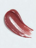 Glossy red lipstick swatch with shimmery texture on white background, showcasing rich color and creamy consistency for cosmetic advertising.