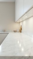 Modern minimalist kitchen with white marble countertops and sleek cabinetry featuring under-cabinet LED lighting for contemporary home design.