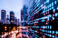 Digital binary code overlay on blurred urban nightscape with glowing skyscrapers and street lights creating futuristic technology concept for digital transformation.