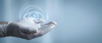 Young adult male hand in white latex glove holding glowing eye icon symbol, representing vision, surveillance, technology, healthcare, and digital innovation concepts for business applications.