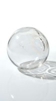 Clear glass sphere with crack isolated on white background for modern home decor and minimalist design projects.
