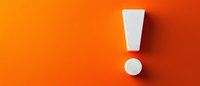 White exclamation mark on vibrant orange background, symbolizing warning, attention, or important announcement for business presentations or safety materials.