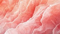 Soft coral pink marble texture with delicate wavy lines and natural stone patterns creates elegant abstract background for luxury design projects.