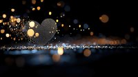 Glowing heart shape formed by sparkling particles against dark background with bokeh lights and reflective surface creates magical romantic atmosphere.