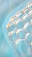 Transparent soap bubbles floating with iridescent reflections on soft blue gradient background for skincare and beauty product design concepts.