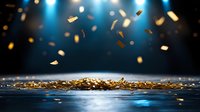 Golden confetti falling on dark surface with dramatic blue spotlight background creates magical celebratory atmosphere for festive events and announcements.
