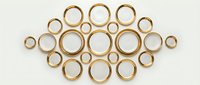Golden metal rings arranged in geometric pattern on white background, isolated for design use on merchandise, textiles, and digital projects.