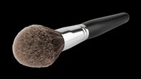 Makeup brush with natural bristles, black handle and chrome ferrule, isolated on transparent background. Ready for beauty product design, cosmetics packaging, tutorials, and print-on-demand applications.