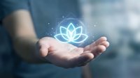 Businessman holding glowing lotus flower symbol in cupped hands representing wellness, mindfulness, meditation, spiritual growth and holistic health concepts.