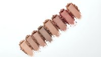 Makeup eyeshadow palette swatches in neutral brown tones on white background. Cosmetic color samples for beauty and fashion applications.