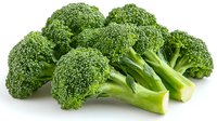 Fresh green broccoli florets with stems arranged on white background, raw organic vegetables isolated for healthy eating and cooking concepts.
