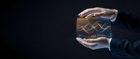 Businessman holding glowing financial chart cube with upward trending graph, representing investment growth, market analysis, and business success strategy.