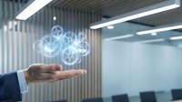 Businessman hand presenting holographic cloud computing network with connected icons in modern office environment for digital transformation concepts.
